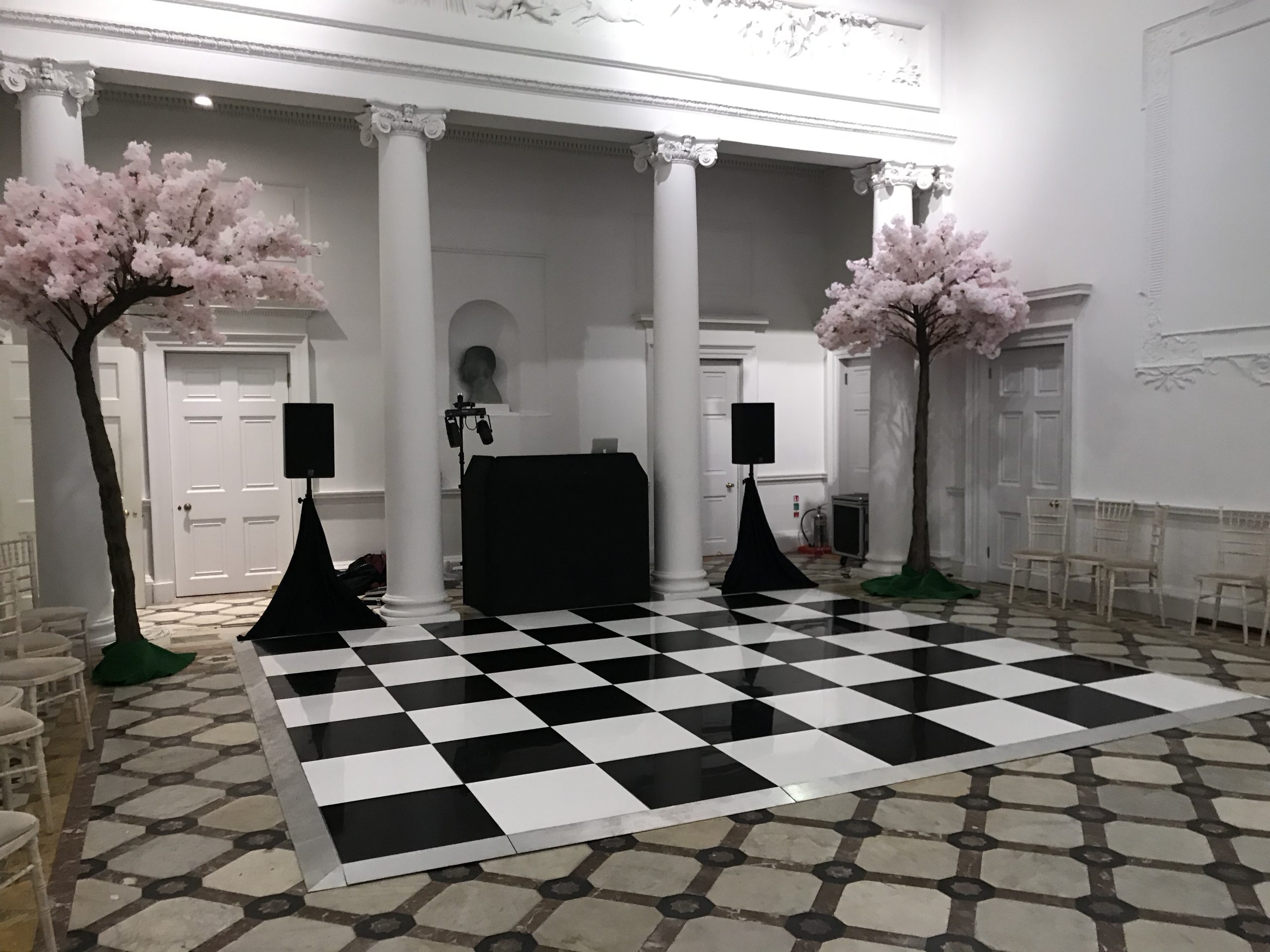 Black and white dance floor with silver edging trim installed at Compton Verney