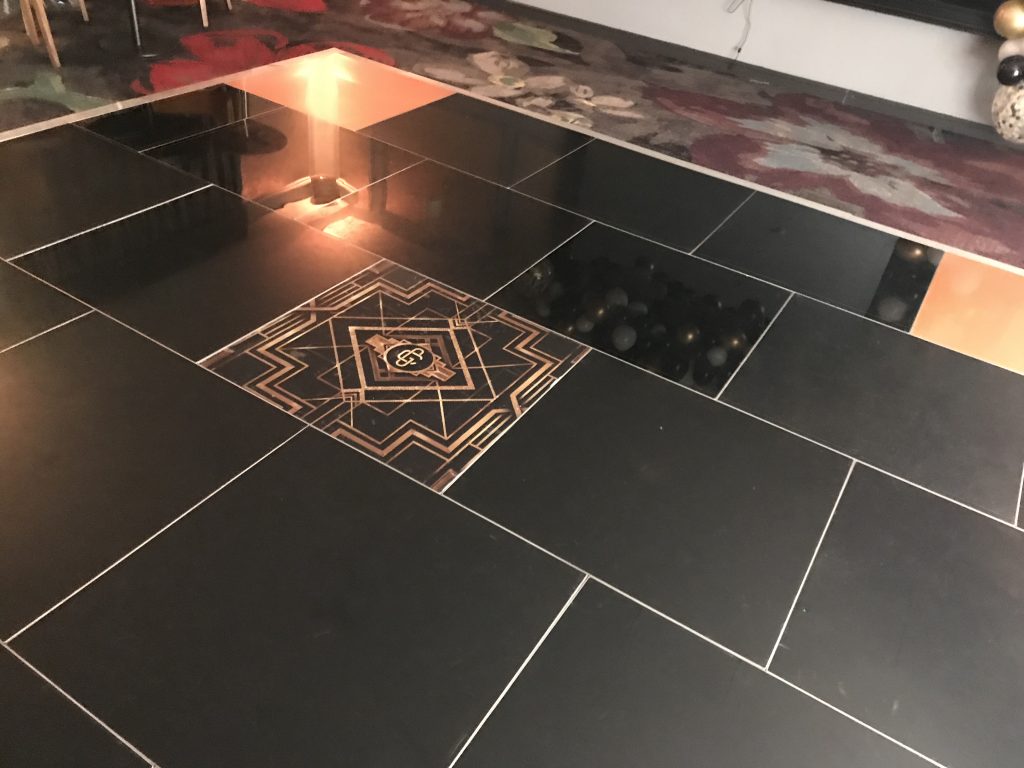 Black and gold dance floor with a 1920s art deco centre panel
