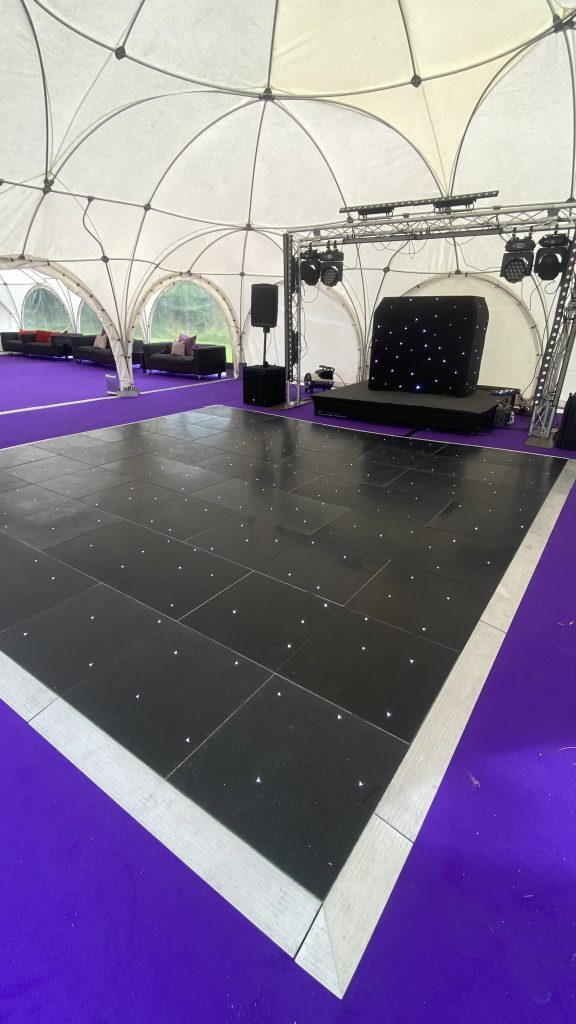 Black starlit dance floor hire in a Marquee