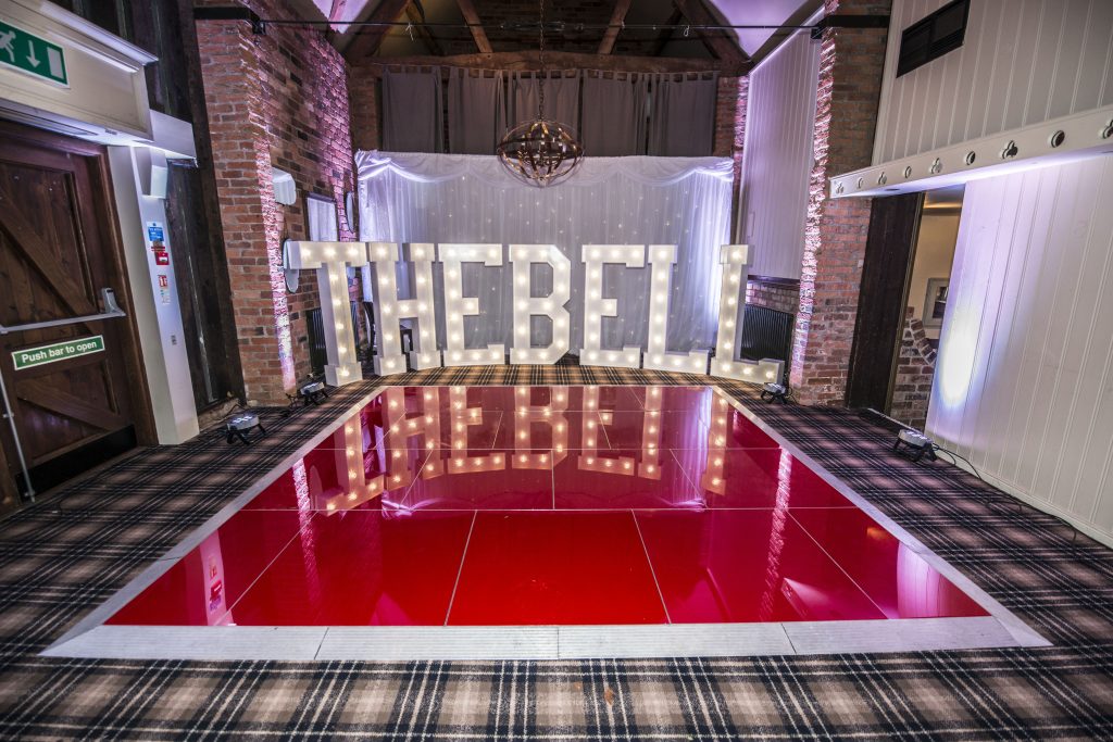 red dance floor at the bell