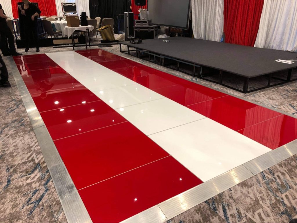 A red and white dance floor for a "Greatest Showman" themed event