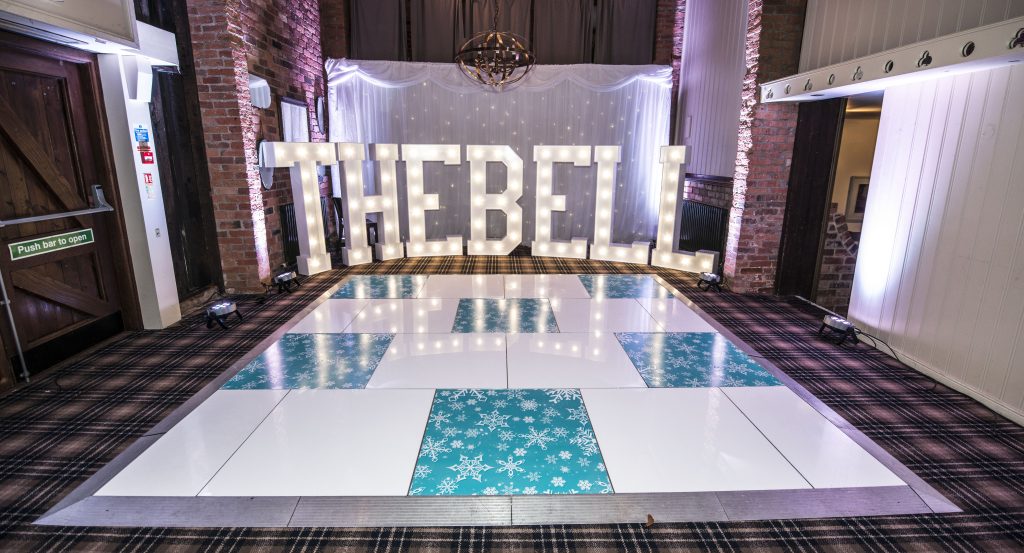 Snowflake and white dance floor at the Bell