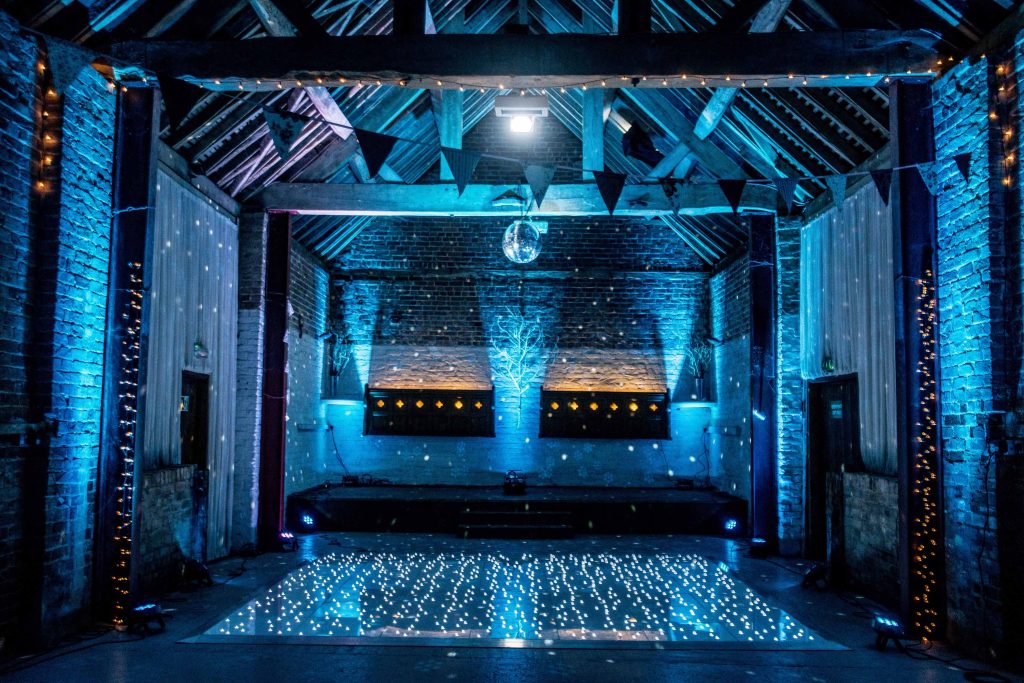 Light blue lighting surround a led white twinkle dance floor