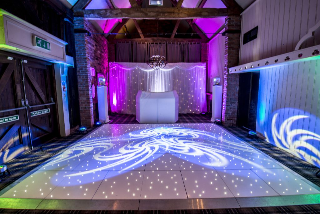White starlit led dance floor with Disco and backdrop