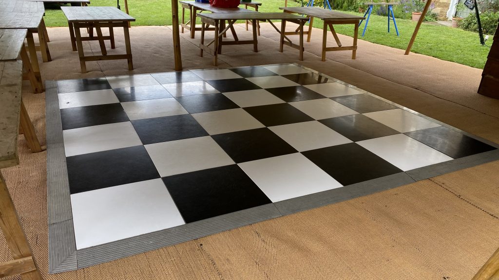 A tipi dance floor black and white hire