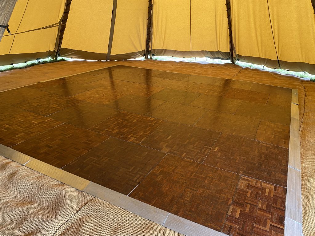 Parquet dance floor inside a tipi