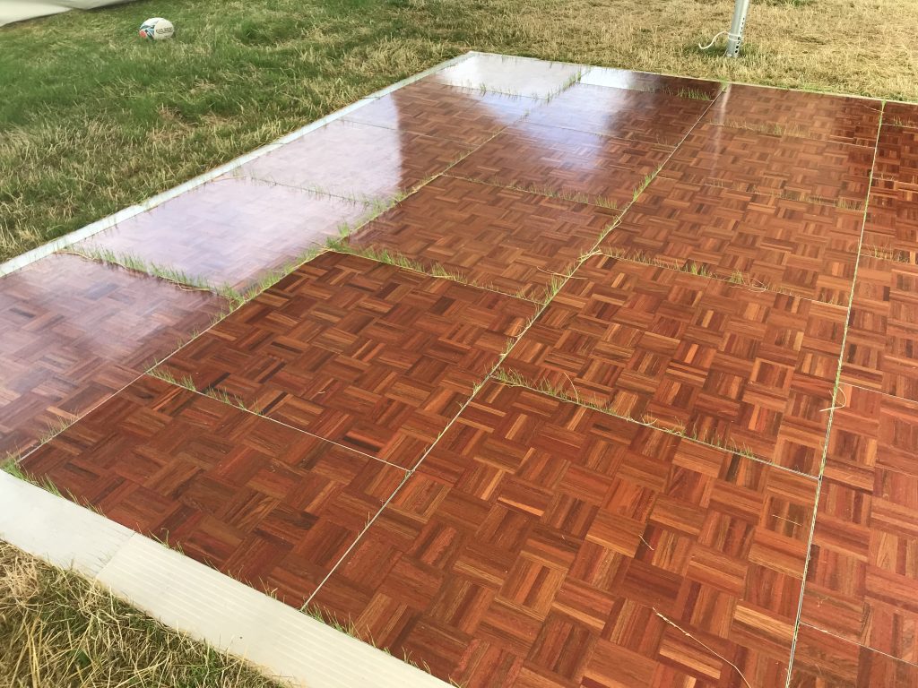 Dan ce floor installed on grass - with the grass growing through.