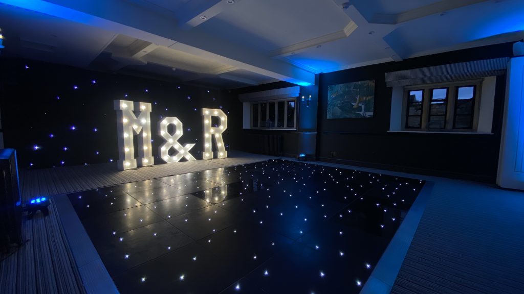 Black starlit dance floor with light up M & R