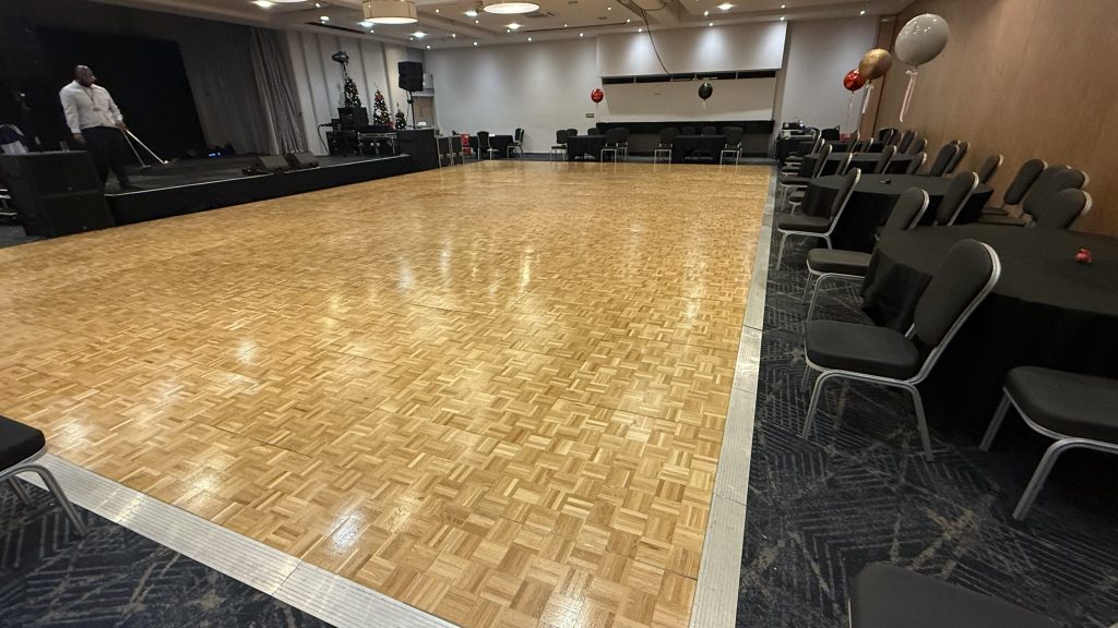 Very large parquet dance floor in light oak