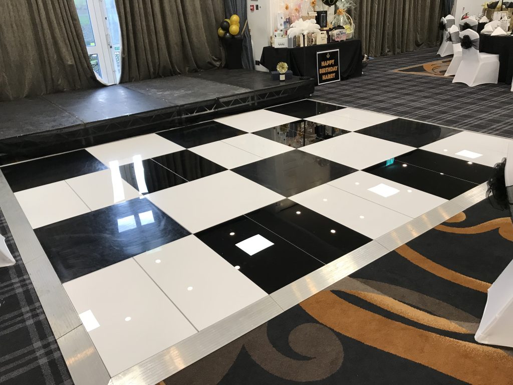 Shiny black and white chequered dance floor