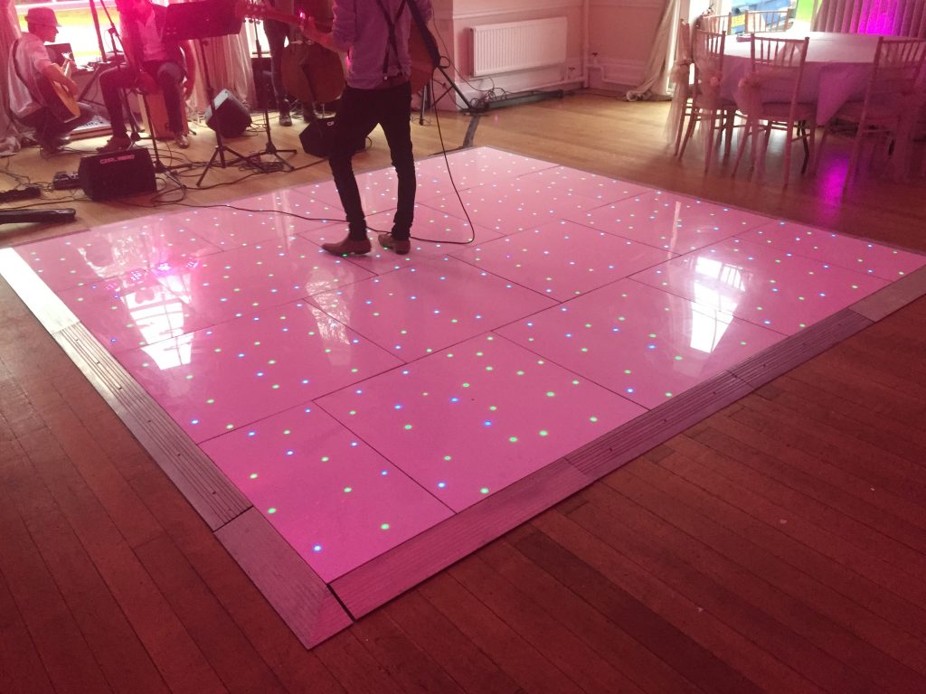 White dance floor with green and blue LEDs