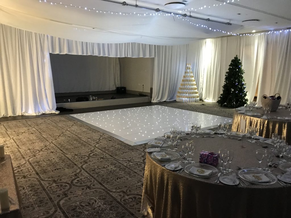 White starlit dance floor in a drapped room