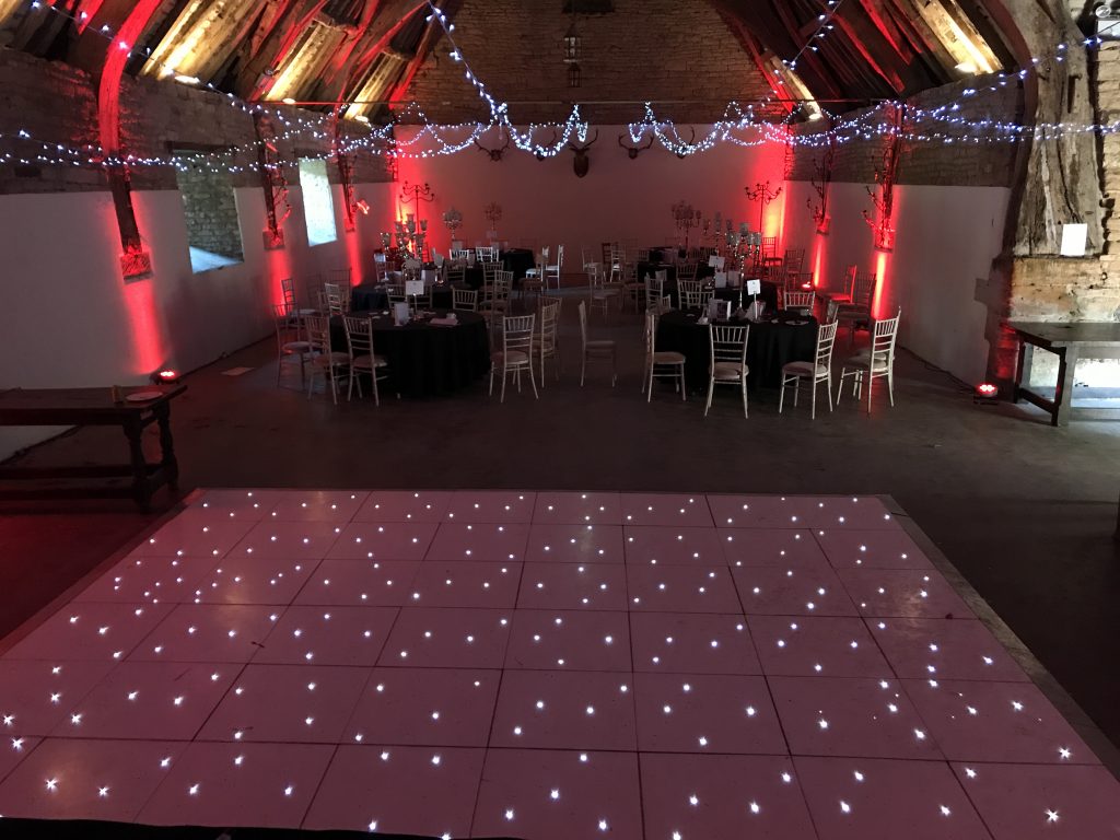 White led dance floor with fairy light ceiling and red room lighting