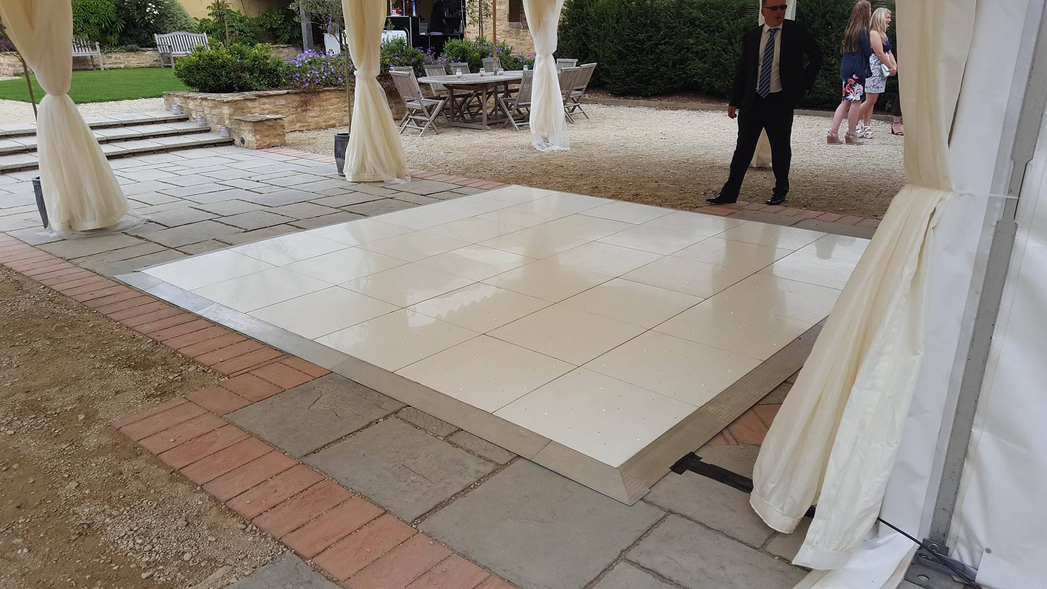 White dance floor under marquee