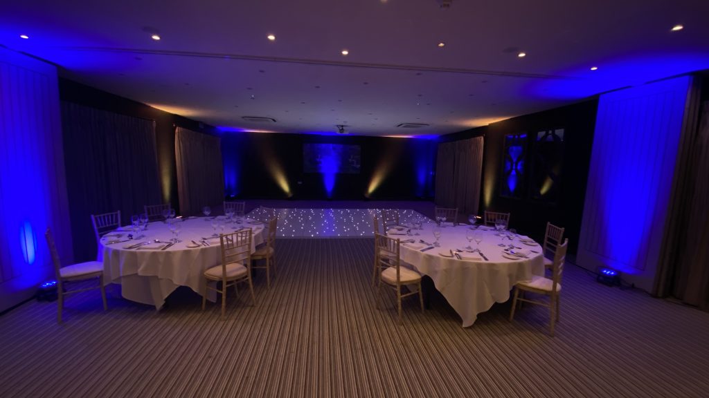 Blue and yellow room lighting with white starlit dance floor