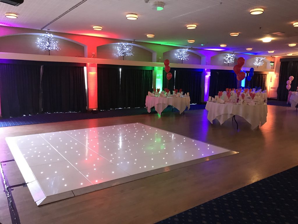 White led dance floor in the Elgar Suite function room at the Abbey Hotel Malvern. Moodlighting around the room with the curtains drawn.