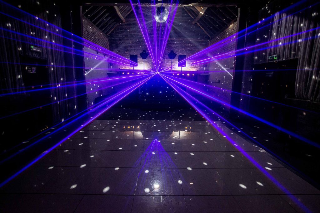 White led dance floor with purple lasers