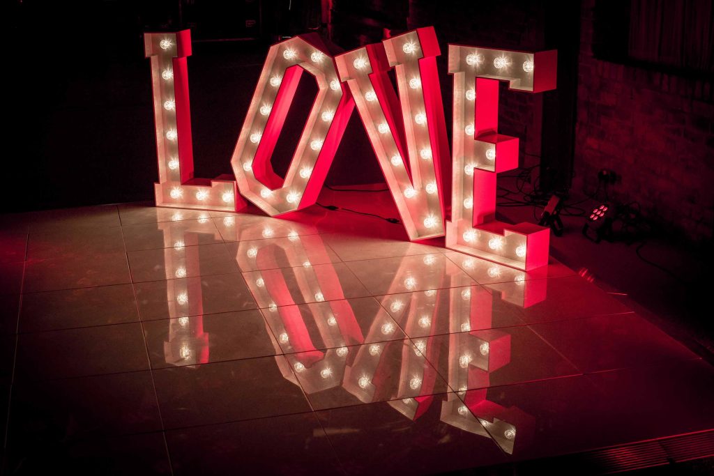 Pure white dance floor with light up LOVE letters
