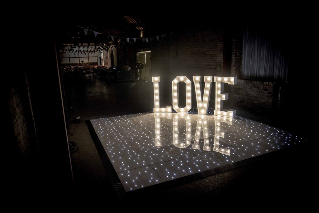 White starlit dance floor with light up LOVE letters