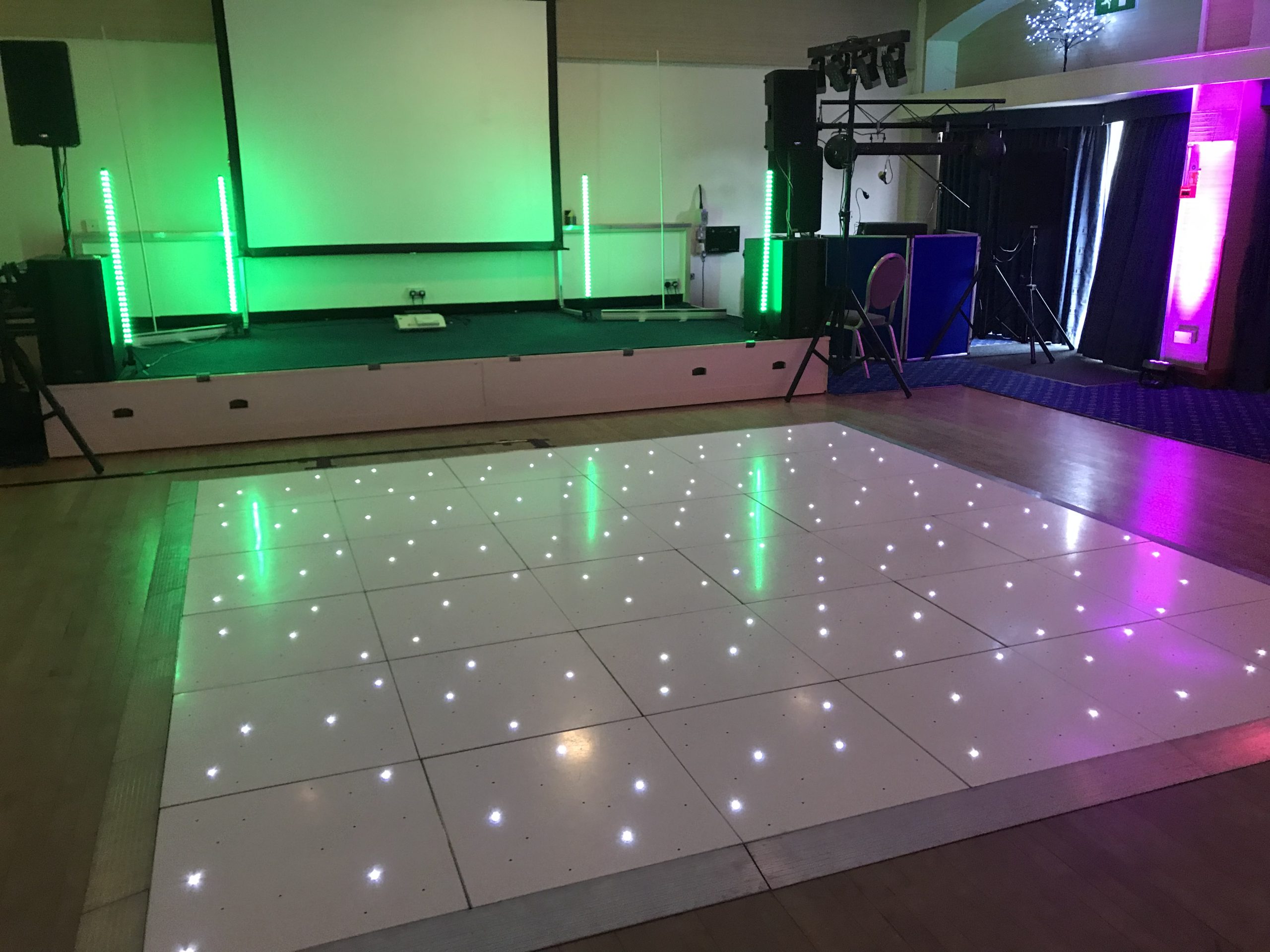 White led starlit dance floor in front of a small stage
