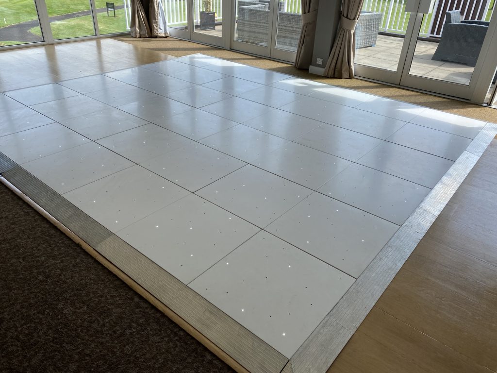 White starlit dance floor installed over a wooden floor