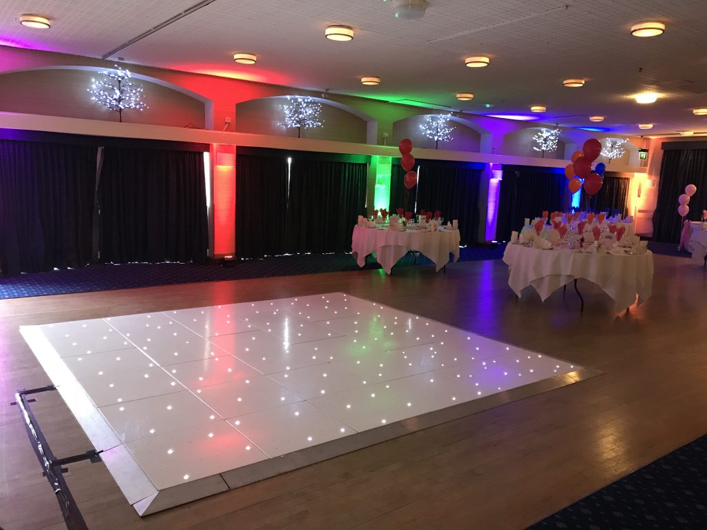 White starlit dance floor with moodlighting behind