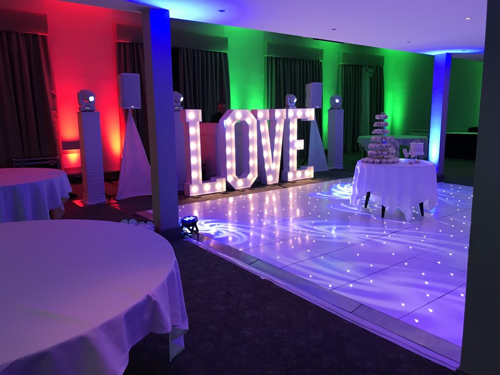 White Starlit dance floor in the courtyard at Walton hall