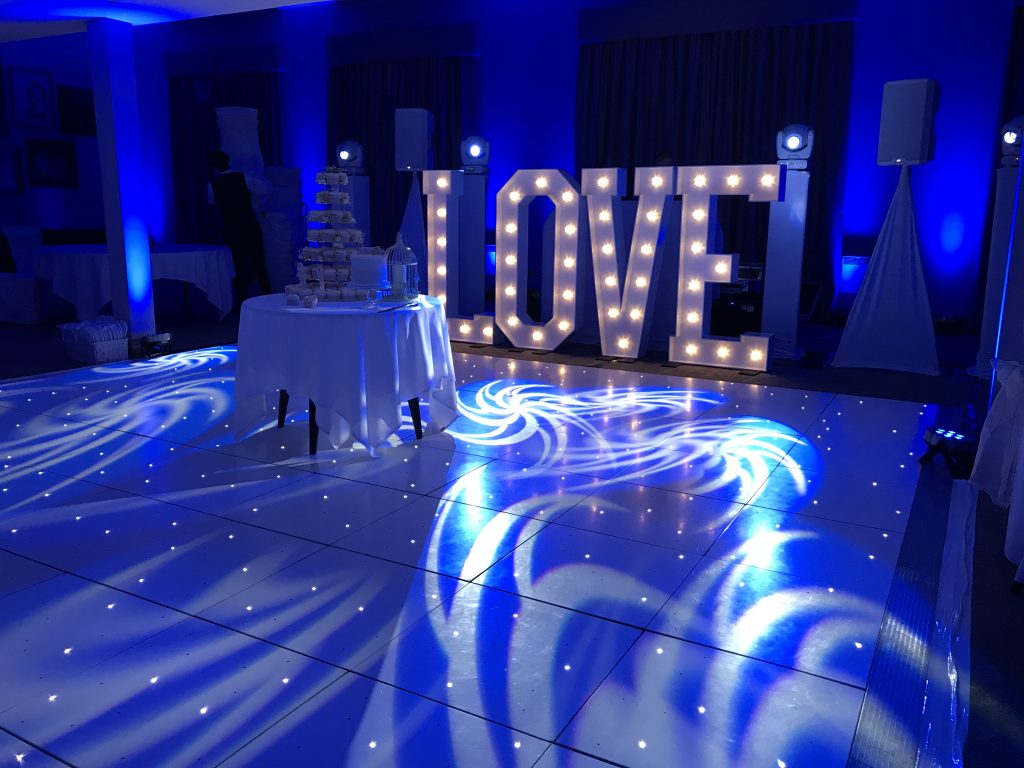 White Starlit dance floor in the courtyard at Walton hall