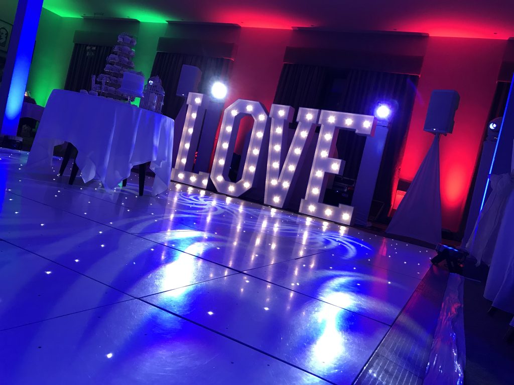White Starlit dance floor in the courtyard at Walton hall