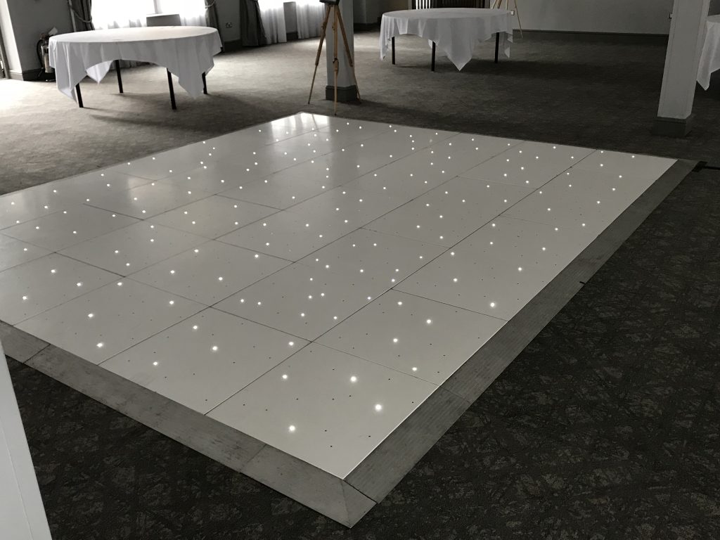 White Starlit dance floor in the courtyard at Walton hall