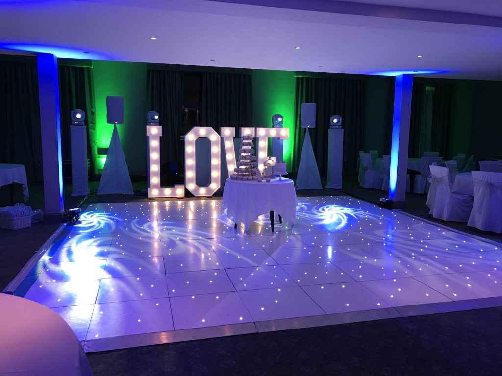 White Starlit dance floor in the courtyard at Walton hall