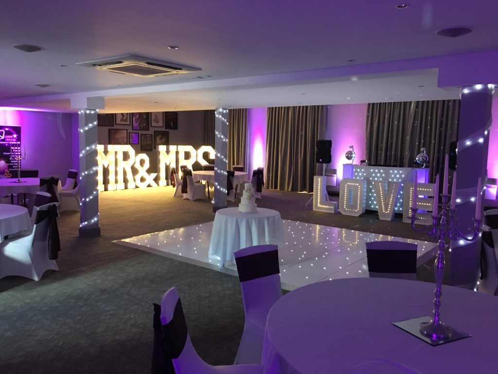 White Starlit dance floor in the courtyard at Walton hall