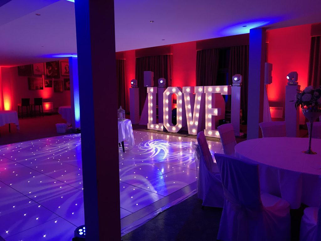 White Starlit dance floor in the courtyard at Walton hall
