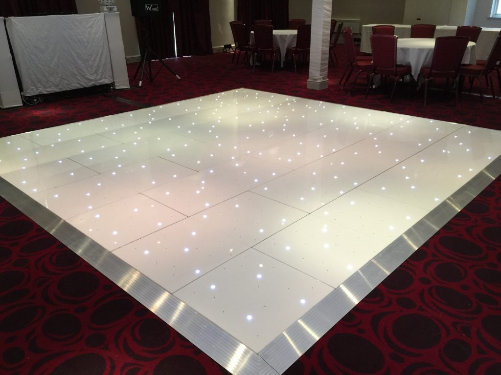 White Starlit dance floor in the courtyard at Walton hall