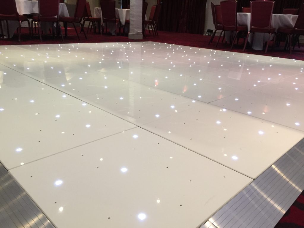 White Starlit dance floor in the courtyard at Walton hall