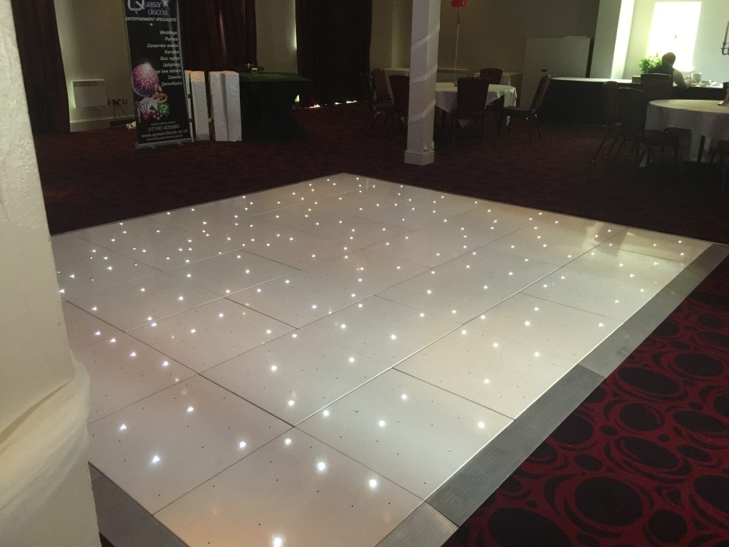 White Starlit dance floor in the courtyard at Walton hall