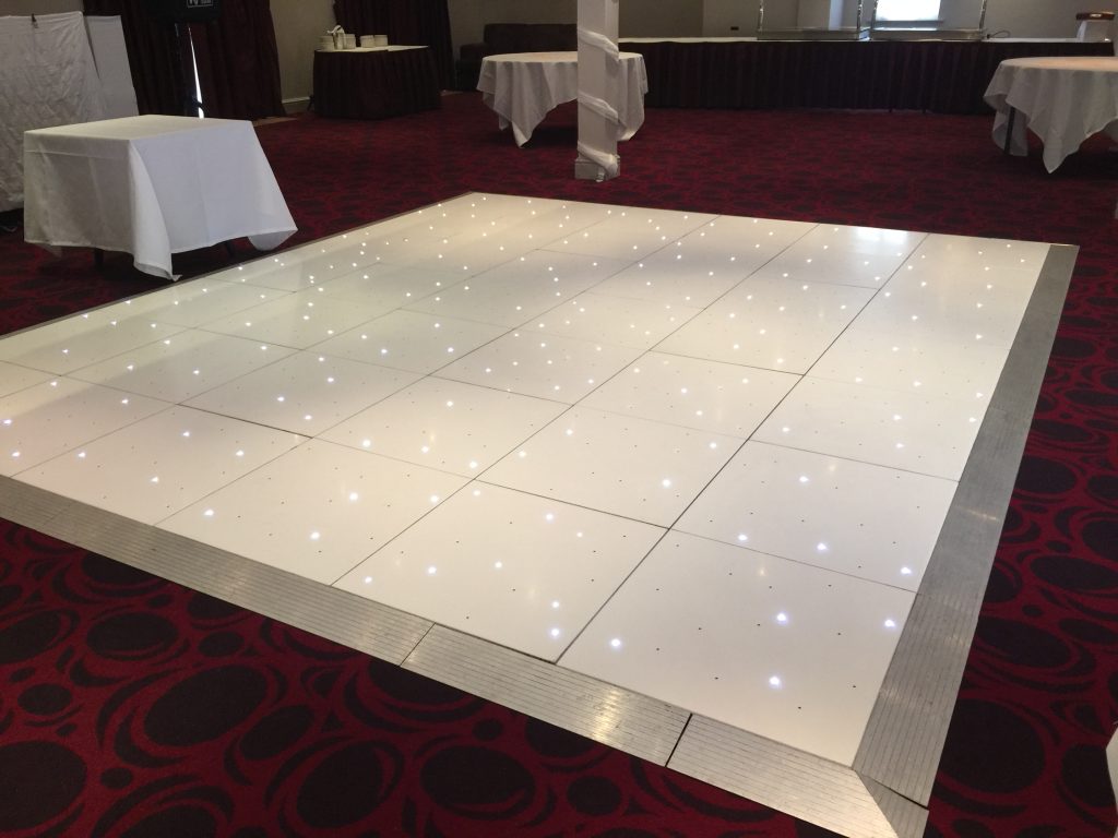 White Starlit dance floor in the courtyard at Walton hall