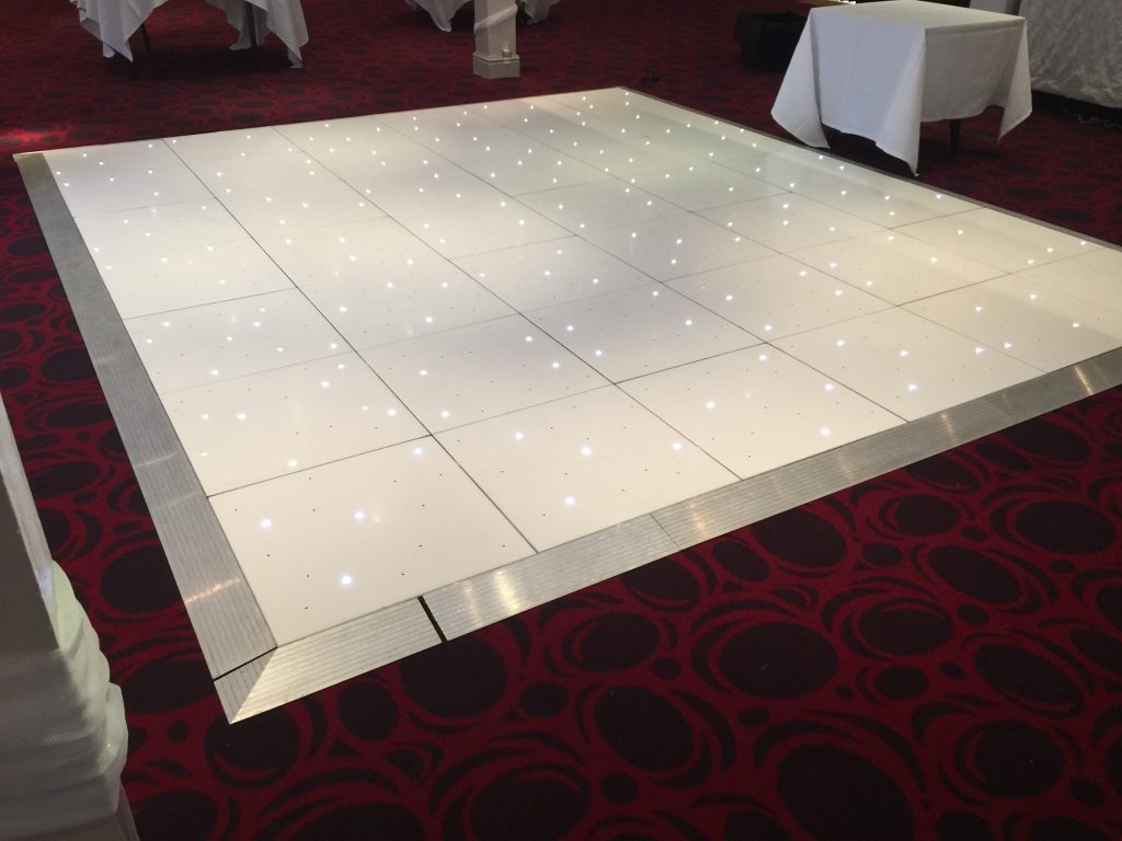 White Starlit dance floor in the courtyard at Walton hall