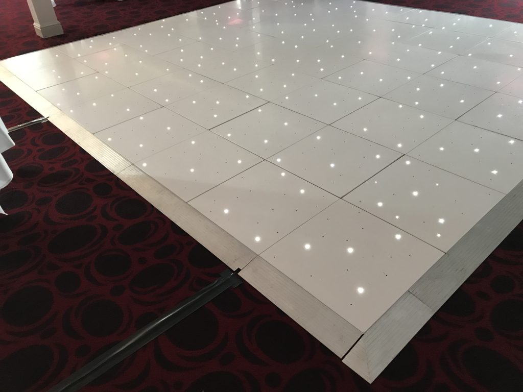 White Starlit dance floor in the courtyard at Walton hall