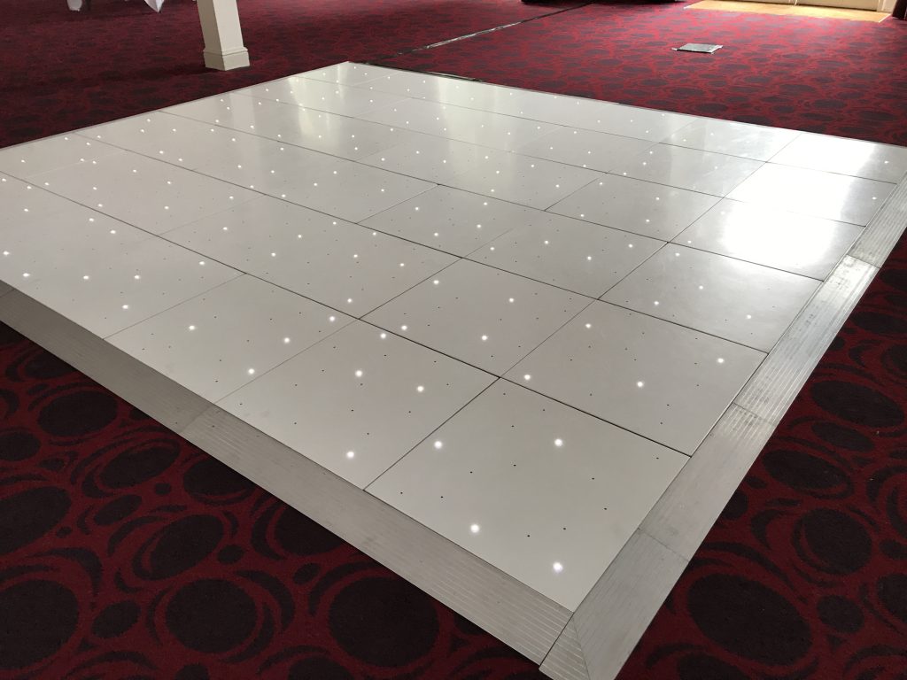 White Starlit dance floor in the courtyard at Walton hall