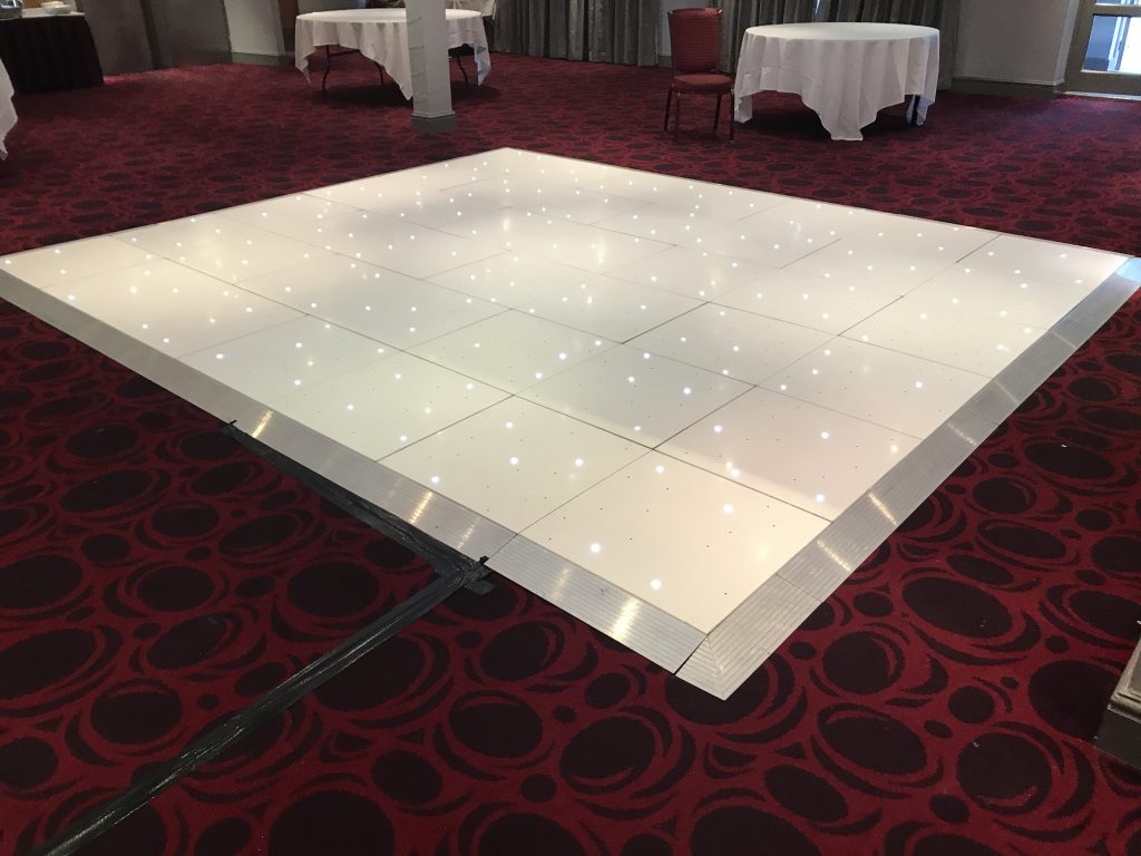 White Starlit dance floor in the courtyard at Walton hall