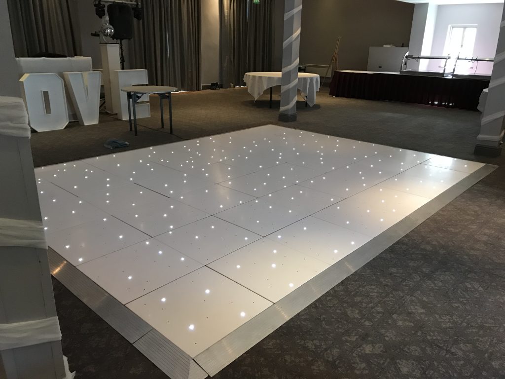 White Starlit dance floor in the courtyard at Walton hall