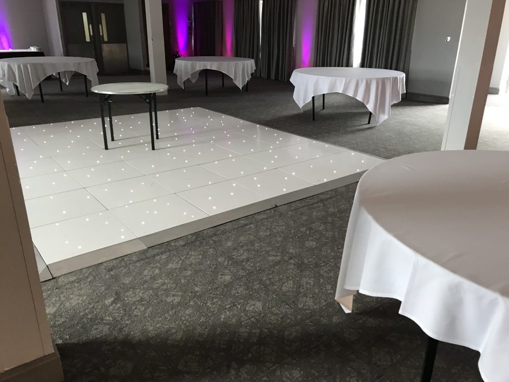 White Starlit dance floor in the courtyard at Walton hall