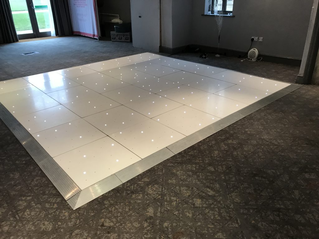 White Starlit dance floor in the courtyard at Walton hall