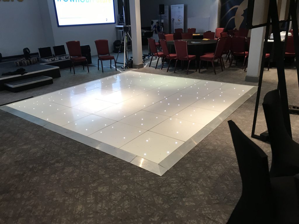 White Starlit dance floor in the courtyard at Walton hall