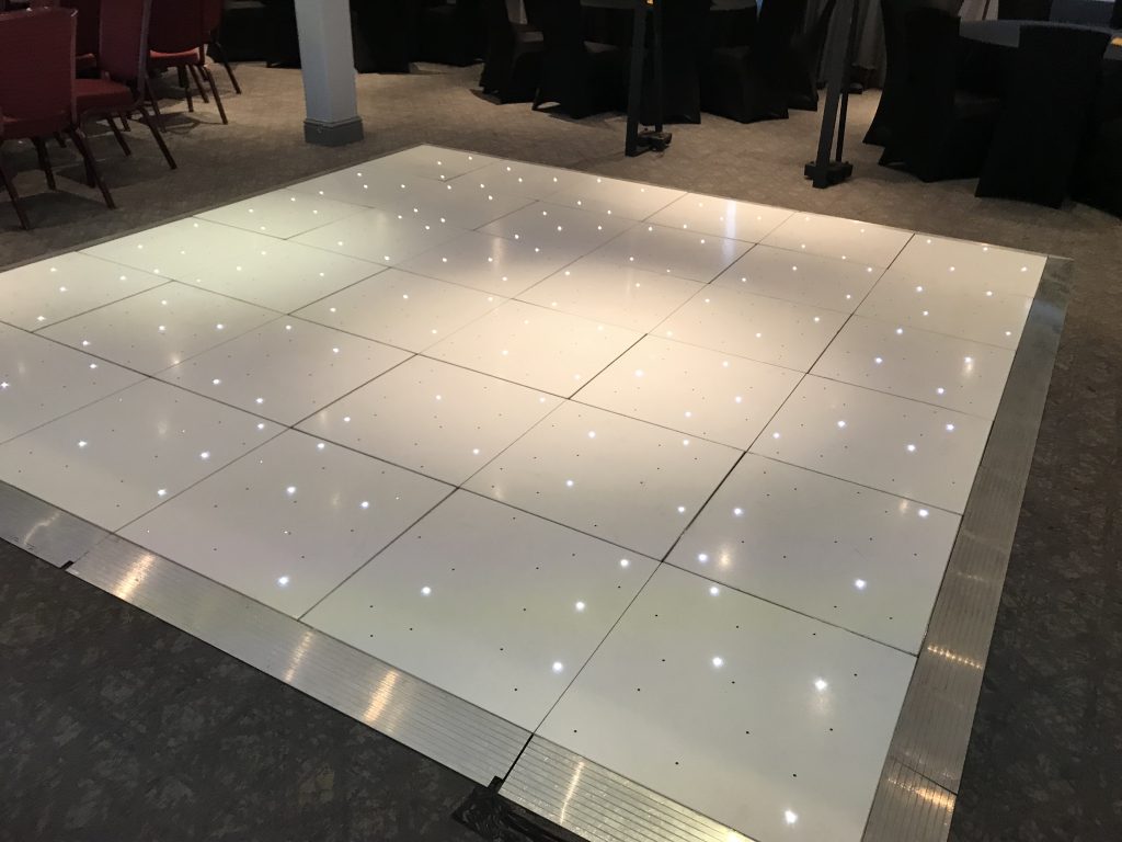 White Starlit dance floor in the courtyard at Walton hall