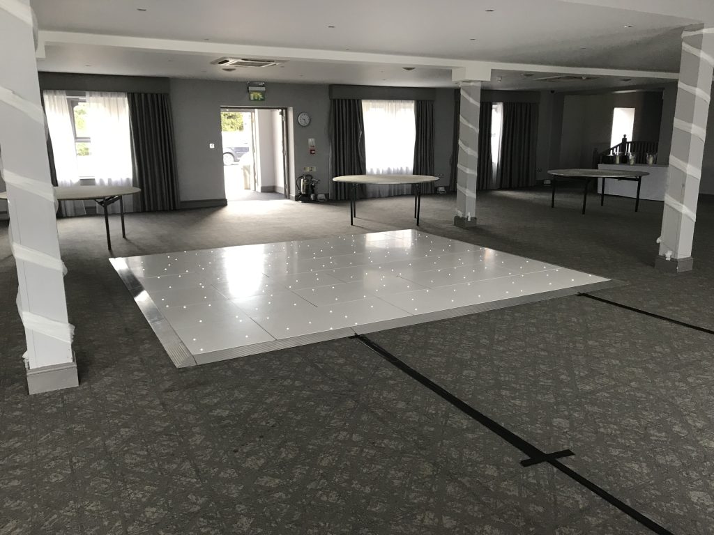 White Starlit dance floor in the courtyard at Walton hall