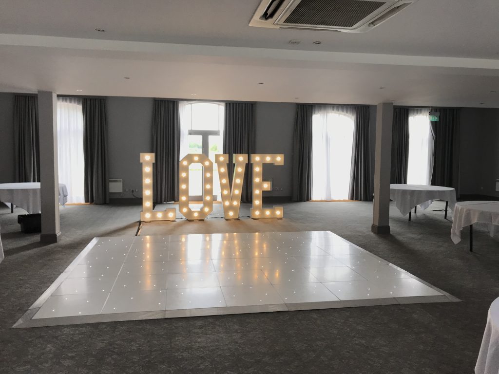 White Starlit dance floor in the courtyard at Walton hall