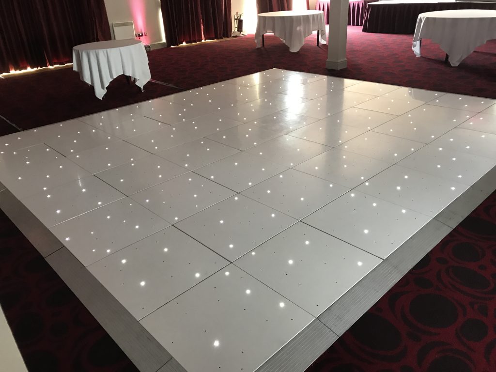 White Starlit dance floor in the courtyard at Walton hall