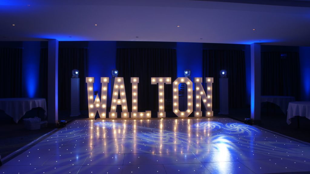 White Starlit dance floor in the courtyard at Walton hall